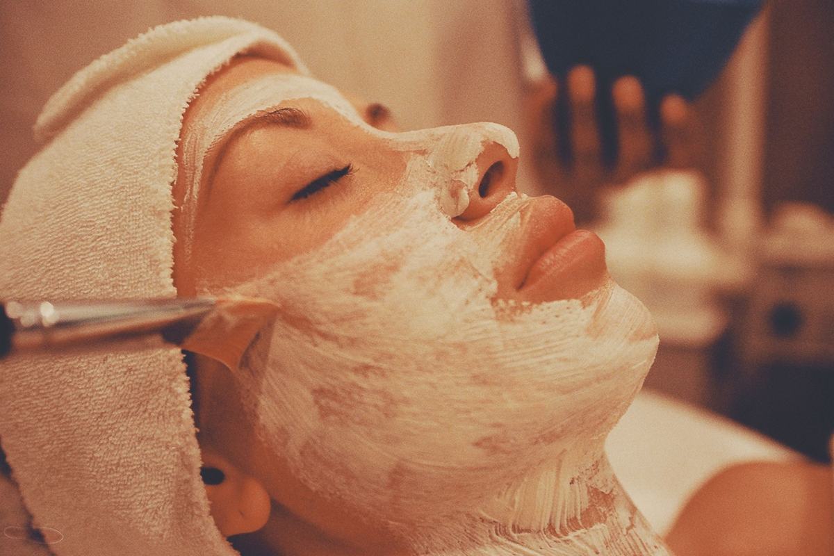 Illustrative image: woman receiving a facial mask